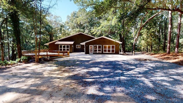 ranch-style house featuring a wooden deck