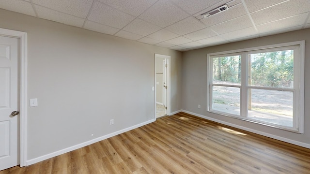 2235 Enterprise Rd, Geneva, AL 36340 - spare room with light hardwood / wood-style flooring and a drop ceiling