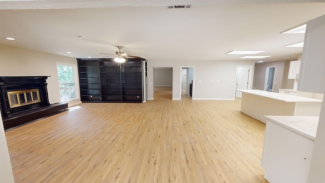 2235 Enterprise Rd, Geneva, AL 36340 - unfurnished living room with ceiling fan and light wood-type flooring