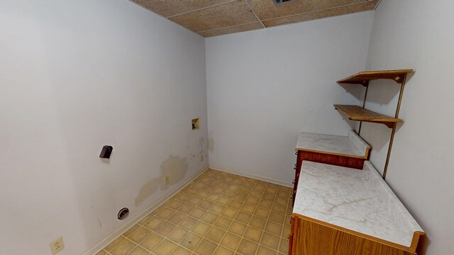 laundry area featuring baseboards, washer hookup, and laundry area