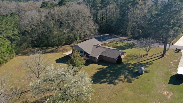 aerial view featuring a wooded view