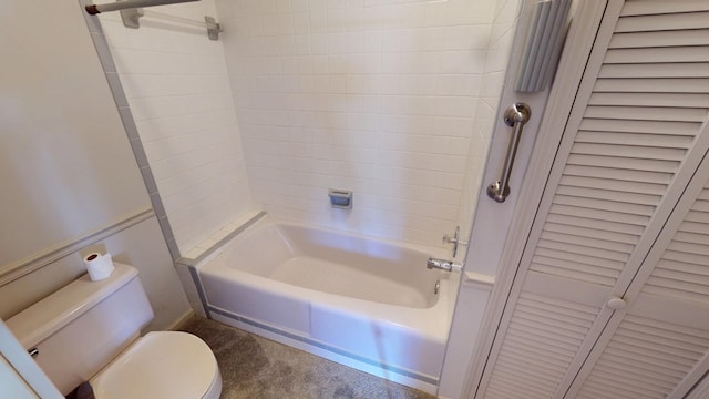 bathroom with a closet, shower / washtub combination, and toilet