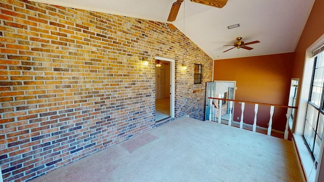 unfurnished sunroom with vaulted ceiling and ceiling fan