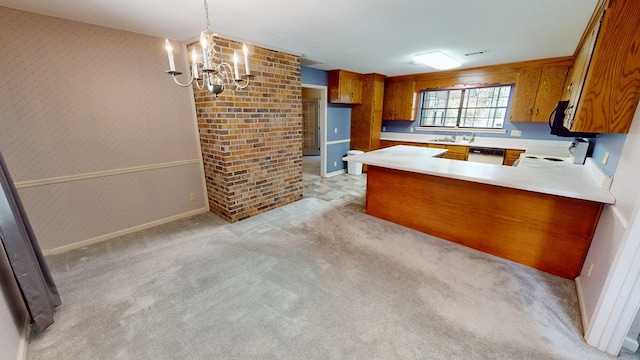 kitchen featuring brown cabinetry, range, wallpapered walls, and a sink