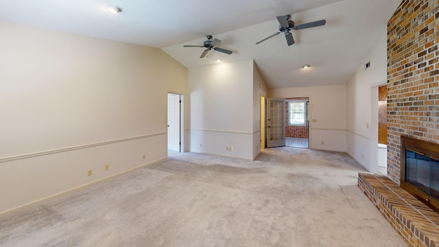 unfurnished living room featuring baseboards, carpet floors, visible vents, a fireplace, and vaulted ceiling