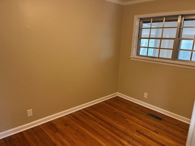 105 Martinson Dr, Abbeville, AL 36310 - unfurnished room with dark wood-style floors and crown molding
