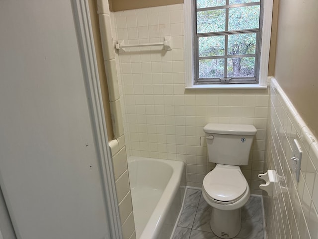 105 Martinson Dr, Abbeville, AL 36310 - full bath with a bathtub, tile walls, and wainscoting