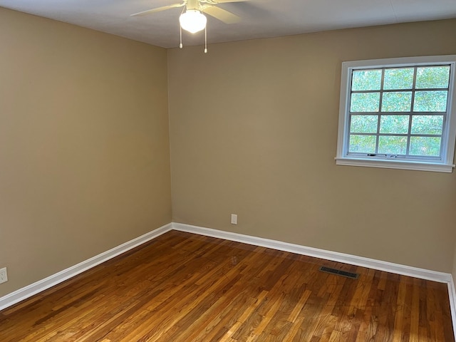 105 Martinson Dr, Abbeville, AL 36310 - empty room featuring ceiling fan and dark wood-type flooring