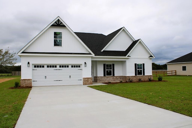 view of front of property with a front lawn and a garage