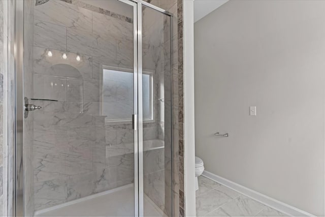 bathroom featuring walk in shower and toilet