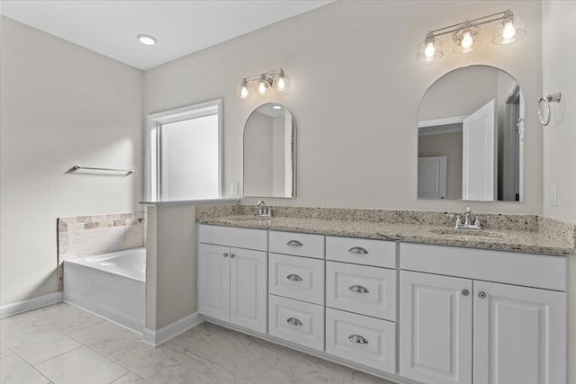 bathroom featuring vanity and a bathing tub