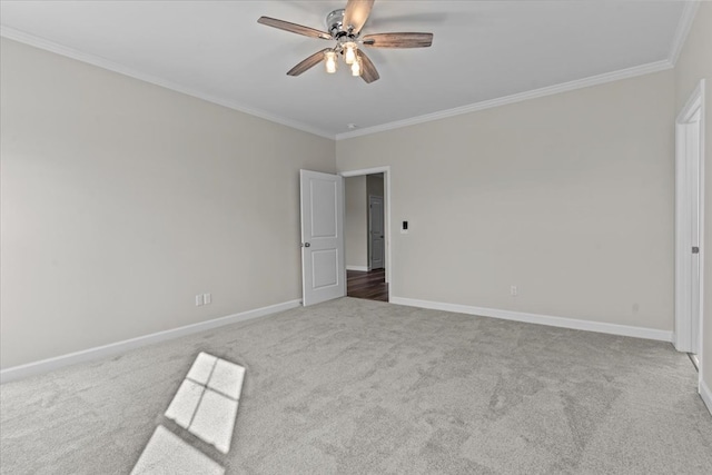 unfurnished bedroom with ornamental molding, carpet floors, and ceiling fan