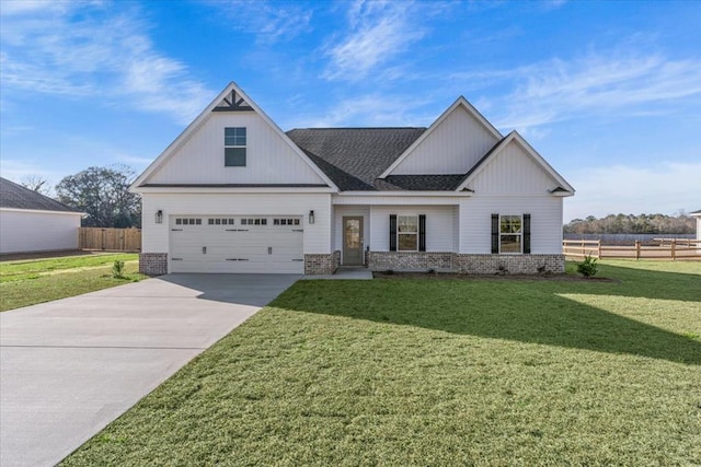 view of front of property with a garage and a front yard