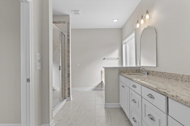 bathroom with vanity and an enclosed shower