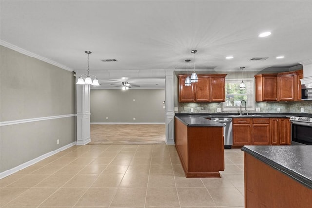 1401 Deese Rd, Ozark, AL 36360 - kitchen with appliances with stainless steel finishes, dark countertops, backsplash, ornamental molding, and pendant lighting