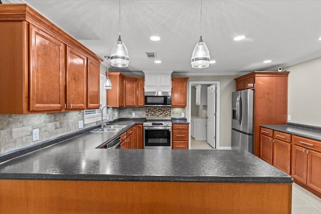 1401 Deese Rd, Ozark, AL 36360 - kitchen with stainless steel appliances, ornamental molding, recessed lighting, tasteful backsplash, and decorative light fixtures