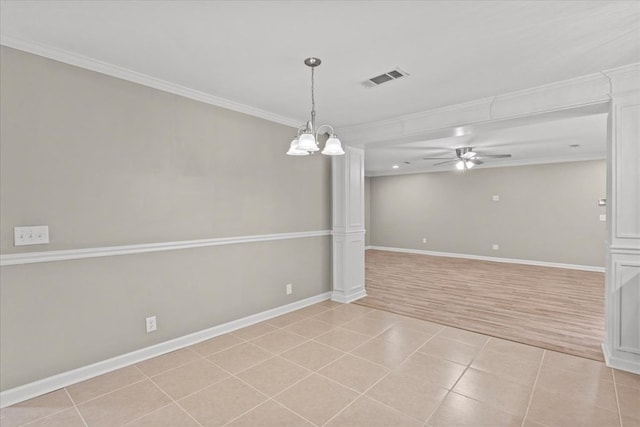 1401 Deese Rd, Ozark, AL 36360 - spare room featuring ornamental molding, a ceiling fan, light tile patterned flooring, and a chandelier
