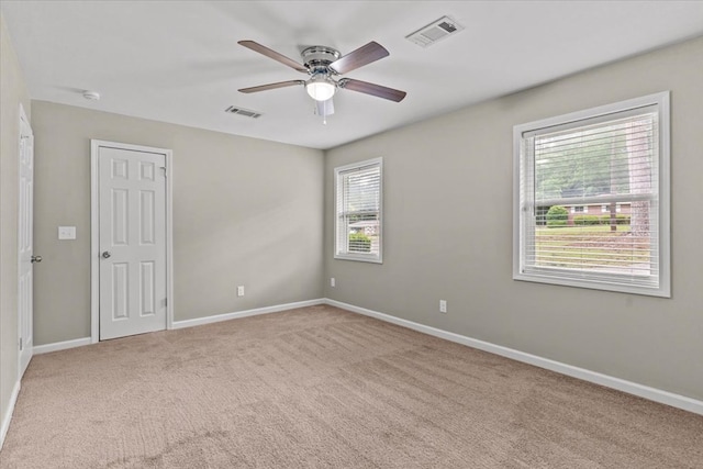 1401 Deese Rd, Ozark, AL 36360 - carpeted empty room featuring a ceiling fan and a smoke detector