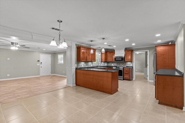 1401 Deese Rd, Ozark, AL 36360 - kitchen featuring appliances with stainless steel finishes, crown molding, open floor plan, recessed lighting, and a peninsula