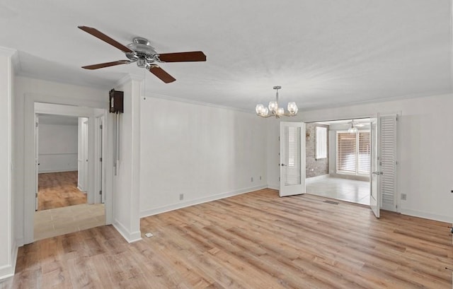 spare room with ceiling fan with notable chandelier, light wood-type flooring, and ornamental molding