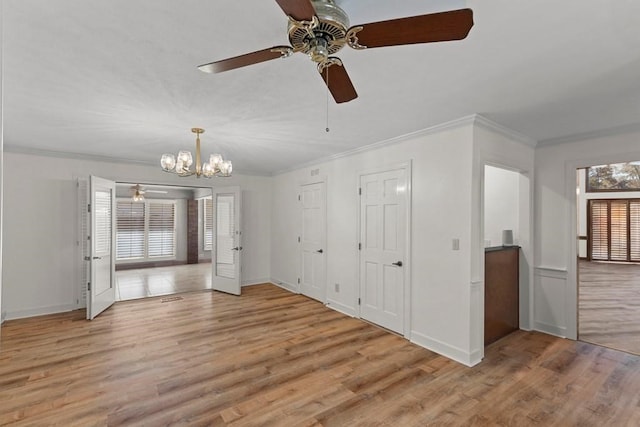 interior space with light wood-type flooring, crown molding, and a wealth of natural light