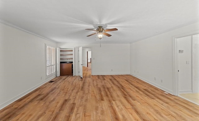 interior space featuring light hardwood / wood-style flooring, ceiling fan, and crown molding