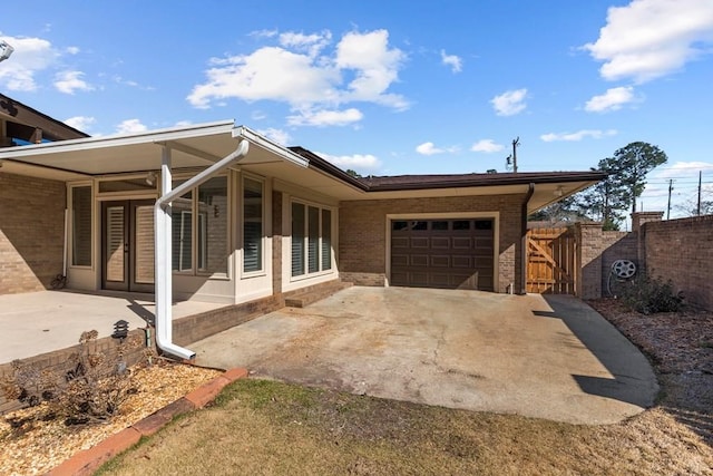 view of front facade featuring a patio area and a garage