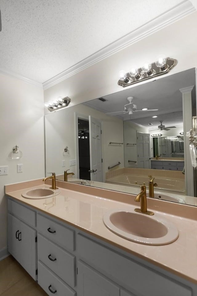 bathroom featuring ornamental molding, a textured ceiling, vanity, ceiling fan, and tile patterned flooring