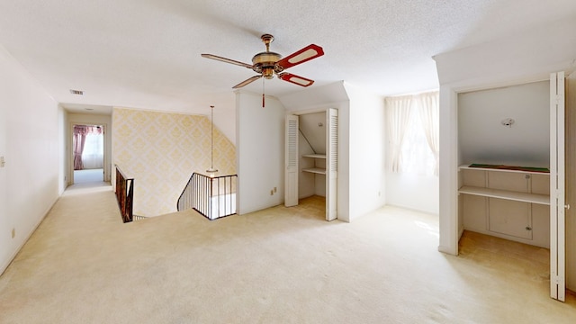 709 Rosemont Dr, Dothan, AL 36303 - interior space featuring visible vents, a textured ceiling, carpet, wallpapered walls, and ceiling fan