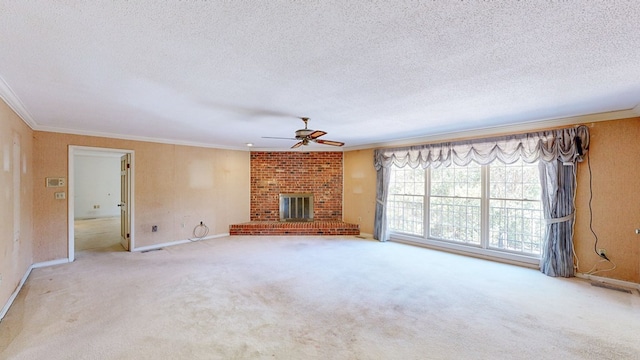 709 Rosemont Dr, Dothan, AL 36303 - unfurnished living room with a textured ceiling, a brick fireplace, a ceiling fan, and crown molding