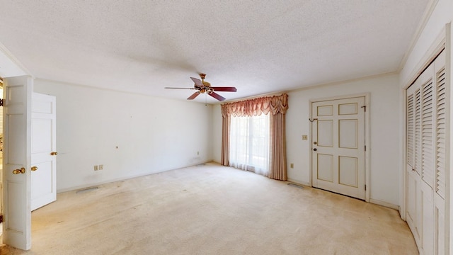 709 Rosemont Dr, Dothan, AL 36303 - unfurnished bedroom with ceiling fan, light colored carpet, a closet, and a textured ceiling