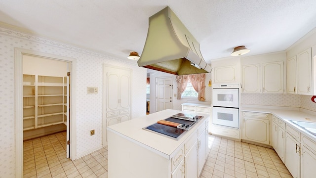 709 Rosemont Dr, Dothan, AL 36303 - kitchen featuring a textured ceiling, range hood, double oven, wallpapered walls, and black electric cooktop