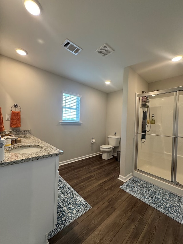 330 Gritney, Daleville, AL 36322 - bathroom featuring wood finished floors, a shower stall, double vanity, and recessed lighting