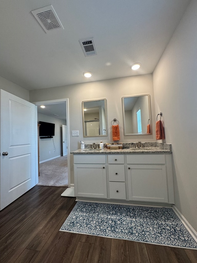 330 Gritney, Daleville, AL 36322 - bathroom with wood finished floors, double vanity, and recessed lighting