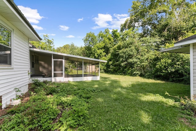 1105 Deborah St, Dothan, AL 36301 - view of green lawn featuring a sunroom
