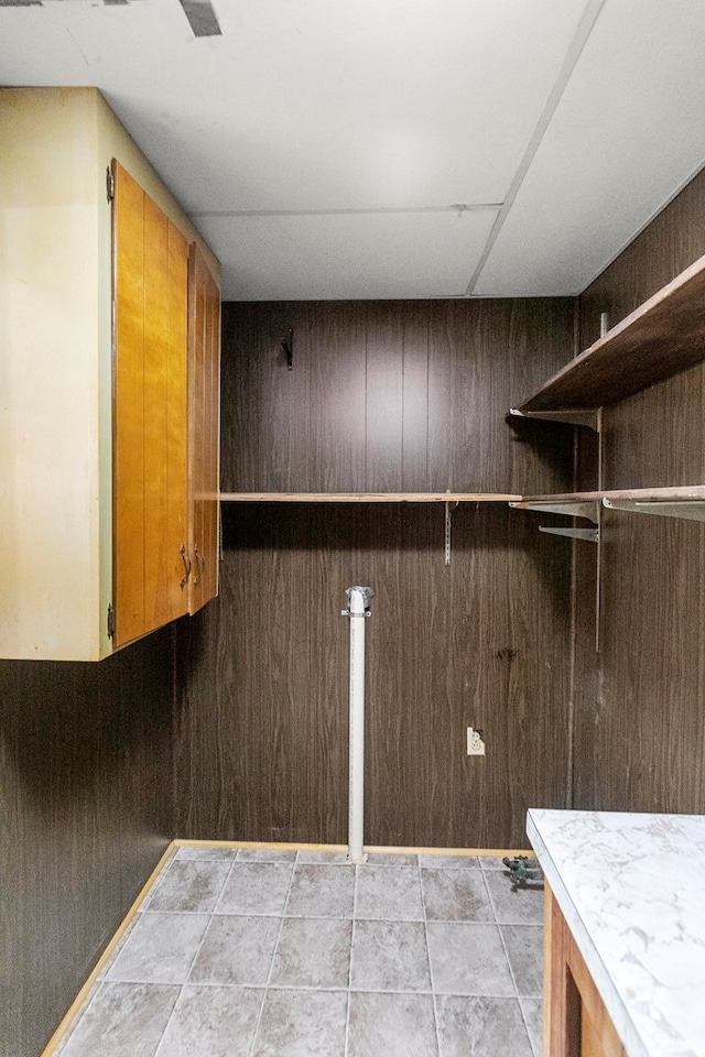 1105 Deborah St, Dothan, AL 36301 - washroom featuring cabinet space and wood walls