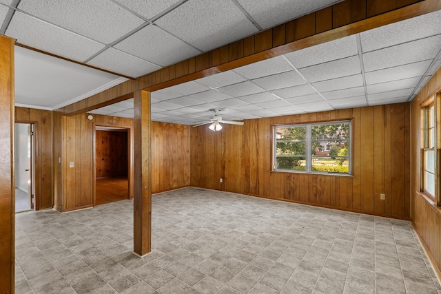 1105 Deborah St, Dothan, AL 36301 - empty room featuring a paneled ceiling, ceiling fan, wood walls, and light floors