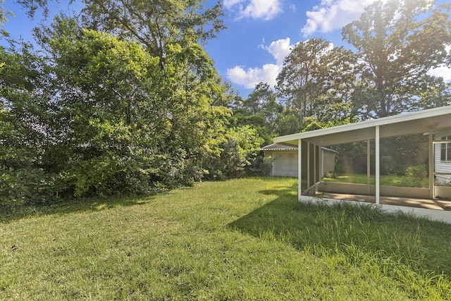 1105 Deborah St, Dothan, AL 36301 - view of green lawn featuring a sunroom