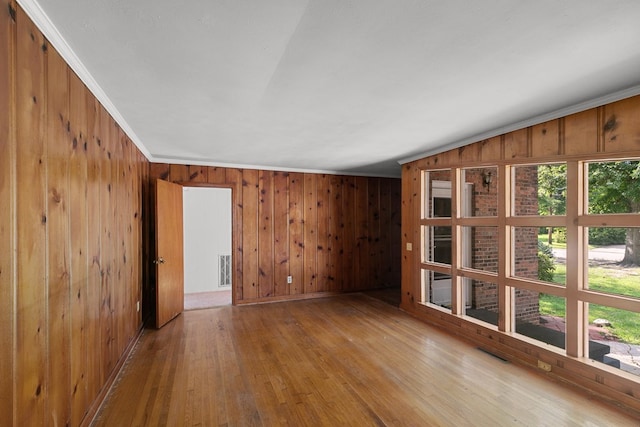 1105 Deborah St, Dothan, AL 36301 - unfurnished room featuring wooden walls, hardwood / wood-style floors, and ornamental molding