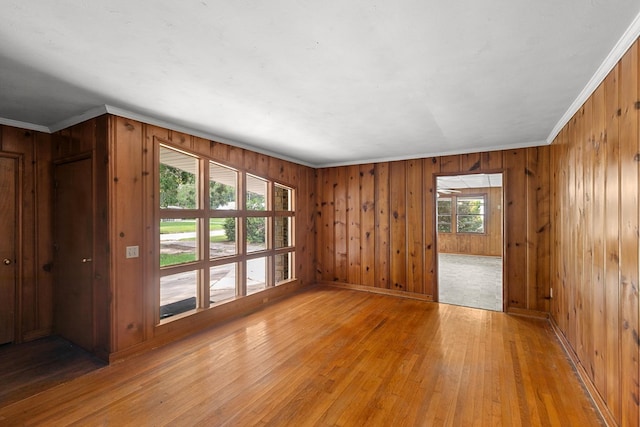 1105 Deborah St, Dothan, AL 36301 - unfurnished room featuring light wood finished floors, crown molding, and wooden walls