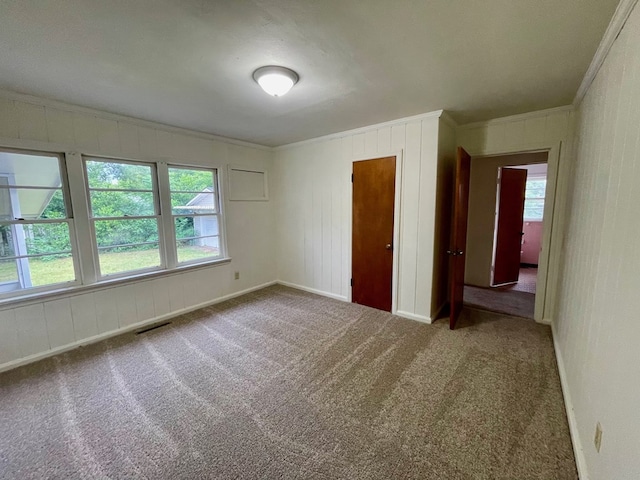 1105 Deborah St, Dothan, AL 36301 - carpeted empty room featuring ornamental molding and plenty of natural light