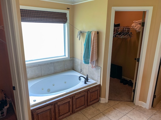 708 Sandstone Dr, Dothan, AL 36303 - bathroom with a whirlpool tub, tile patterned flooring, and a walk in closet