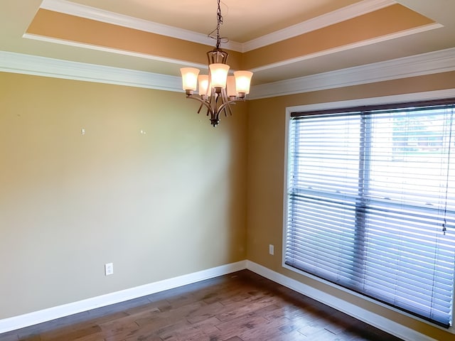 708 Sandstone Dr, Dothan, AL 36303 - empty room featuring a tray ceiling, dark wood-style floors, a chandelier, and crown molding