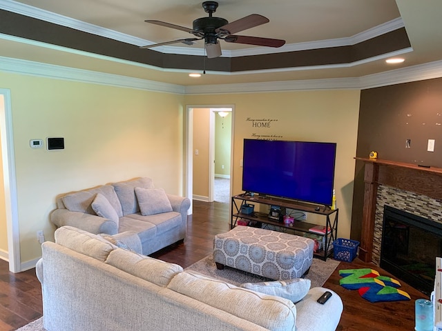 708 Sandstone Dr, Dothan, AL 36303 - living area with a raised ceiling, crown molding, wood finished floors, ceiling fan, and a fireplace