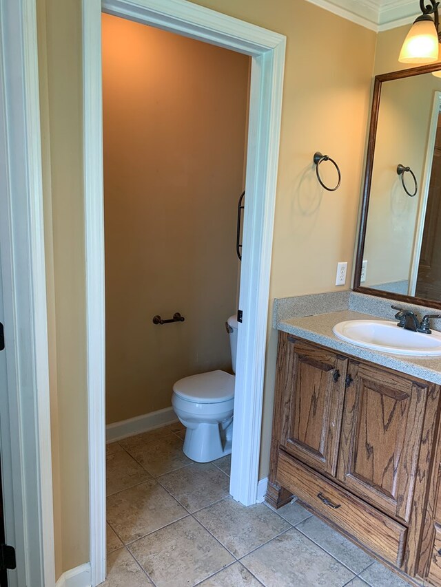 708 Sandstone Dr, Dothan, AL 36303 - bathroom featuring vanity, ornamental molding, and tile patterned flooring