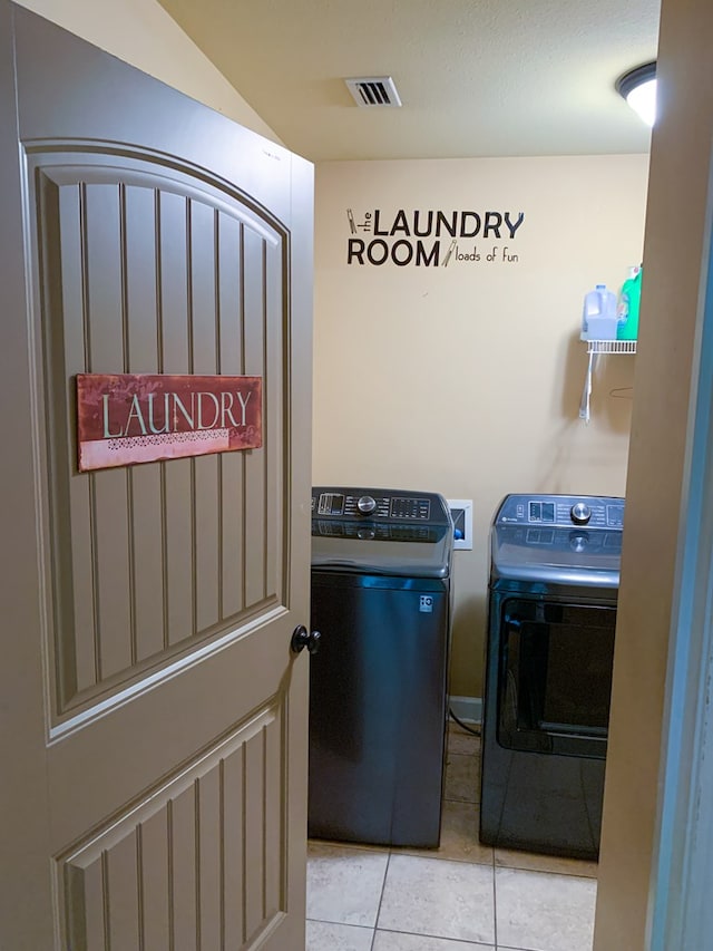 708 Sandstone Dr, Dothan, AL 36303 - washroom with washer and dryer and tile patterned floors