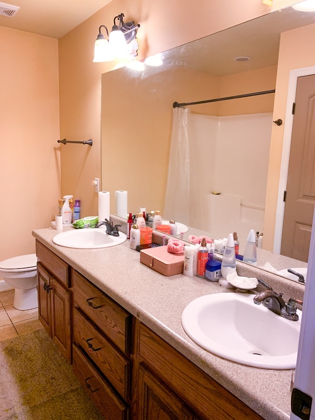 708 Sandstone Dr, Dothan, AL 36303 - full bathroom with double vanity, tile patterned floors, and curtained shower