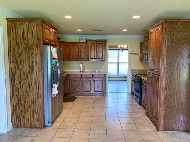 708 Sandstone Dr, Dothan, AL 36303 - kitchen with appliances with stainless steel finishes, crown molding, recessed lighting, light tile patterned floors, and light countertops