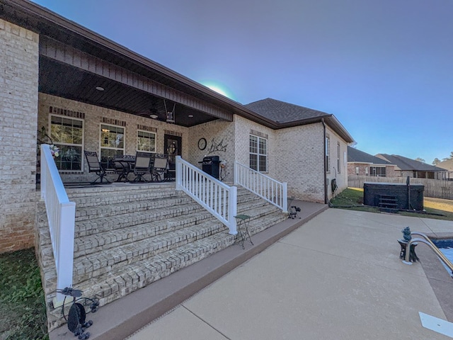 exterior space featuring ceiling fan