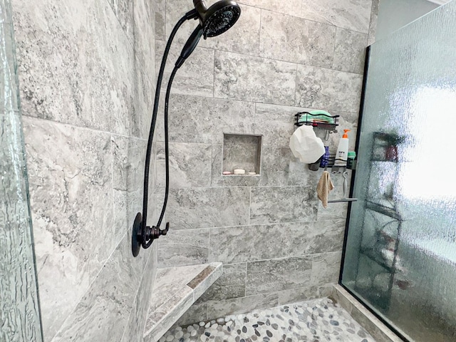 bathroom with tiled shower